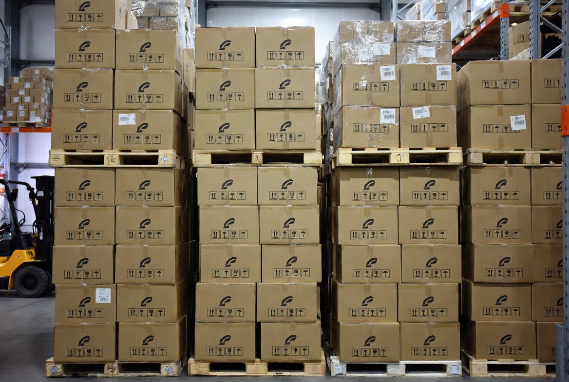 Warehouse Stacked Shipping Cartons